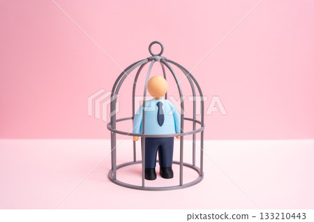 Office worker in a cage. Contractual obligations. NDA agreement. Restrictions and self-isolation from opportunities for growth and development. Limited freedom, and workplace pressure. Employment law Office worker in a cage. Contractual obligations. NDA agreement. Restrictions and self-isolation from opportunities for growth and development. Limited freedom, and workplace pressure. Employment law 133210443