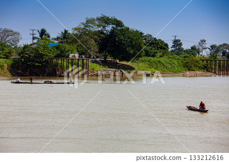 People at traditional wooden canoes at the Sinu River in Lorica, Colombia 133212616