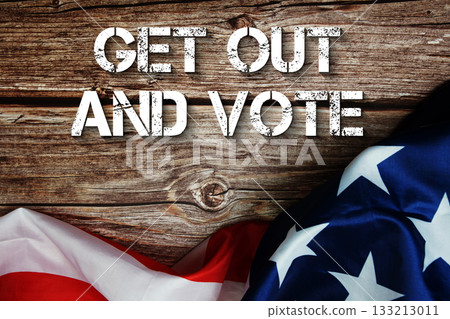 Get Out And Vote text message with USA flag on wooden background Get Out And Vote text message with USA flag on wooden background 133213011