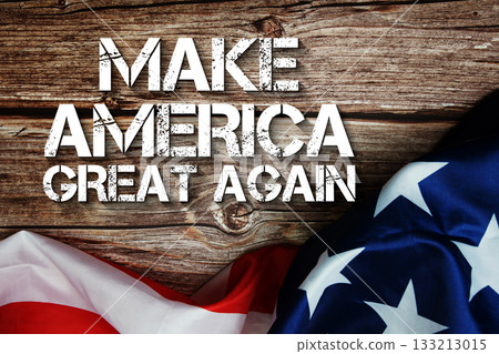 Make America Great Again text message with USA flag on wooden background Make America Great Again text message with USA flag on wooden background 133213015