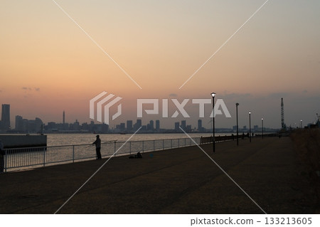 The view under the Yokohama Bay Bridge and the silhouette of Minato Mirai at dusk The view under the Yokohama Bay Bridge and the silhouette of Minato Mirai at dusk 133213605