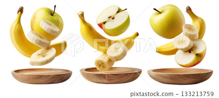 Whole and sliced apple and banana served on round wooden plate, isolated on white transparent background. Whole and sliced apple and banana served on round wooden plate, isolated on white transparent background. 133213759