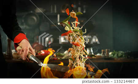 Freeze Motion of Flying Asian Meal with Vegetable and Prawns into Wok Pan Freeze Motion of Flying Asian Meal with Vegetable and Prawns into Wok Pan 133214467
