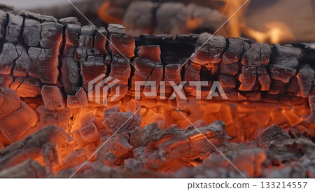 Close-up of Hot Embers with Flying Sparks . Concept of heating Fireplace 133214557