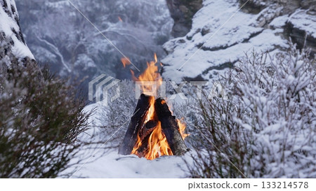 Crackling Campfire in the Winter Foggy Mountains , Harsh Atmosphere , Authentic Place 133214578