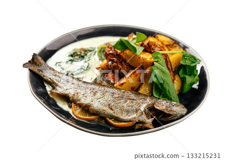 Baked whole trout with potatoes and creamy sauce Baked whole trout with potatoes and creamy sauce 133215231