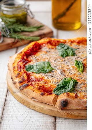 Italian pizza with spinach and cheese Italian pizza with spinach and cheese 133215244