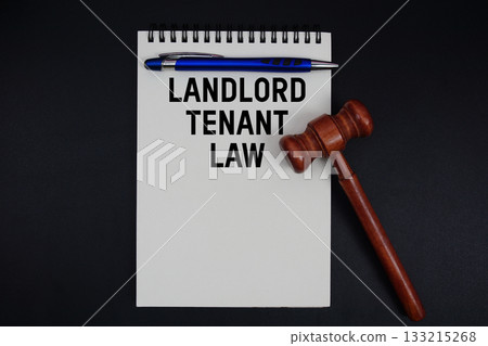 Landlord Tenant Law text written on notepad with gavel on black background Landlord Tenant Law text written on notepad with gavel on black background 133215268