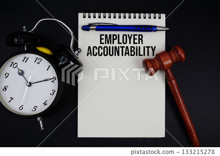Employer Accountability text written on notepad with gavel and alarm clock on black background 133215278