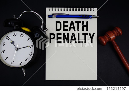 Death Penalty text written on notepad with gavel and alarm clock on black background 133215297