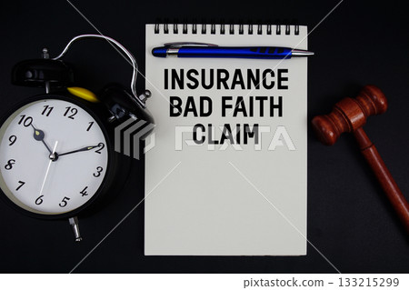 Insurance Bad Faith Claim text written on notepad with gavel and alarm clock on black background 133215299