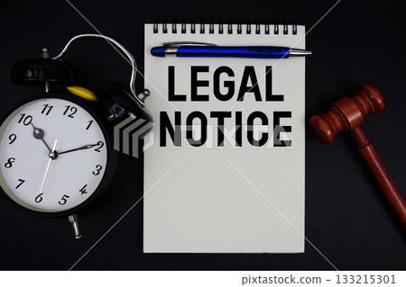 Legal Notice text written on notepad with gavel and alarm clock on black background Legal Notice text written on notepad with gavel and alarm clock on black background 133215301