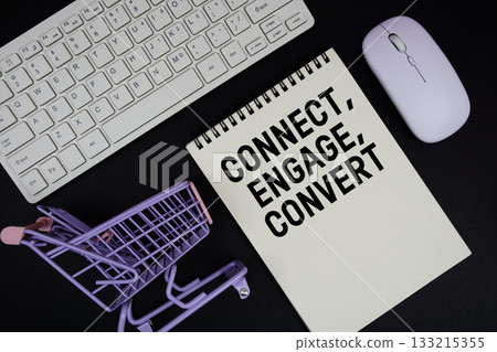 Connect, Engage, Convert text written on notepad with keyboard and trolley shopping cart on black background 133215355