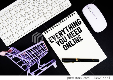 Everything You Need Online text written on notepad with keyboard and trolley shopping cart on black background 133215361