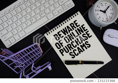 Beware Of Online Purchase Scams text written on notepad with keyboard and trolley shopping cart on black background 133215366