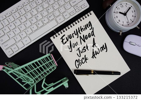 Everything You Need, Just A Click Away text written on notepad with keyboard and trolley shopping cart on black background Everything You Need, Just A Click Away text written on notepad with keyboard and trolley shopping cart on black background 133215372