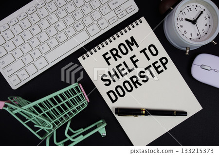 From Shelf To Doorstep text written on notepad with keyboard and trolley shopping cart on black background From Shelf To Doorstep text written on notepad with keyboard and trolley shopping cart on black background 133215373