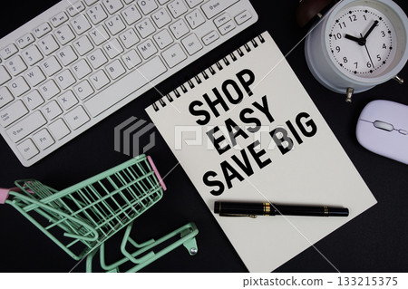 Shop Easy. Save Big text written on notepad with keyboard and trolley shopping cart on black background 133215375