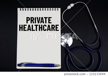 Notepad with "Private Healthcare" a pen, gavel, and stethoscope on a black background 133215644