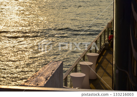 The sunset seascape from the waterfront. Nature scene. Shiny sea. The sunset seascape from the waterfront. Nature scene. Shiny sea. 133216003