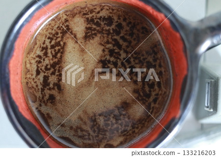 A mysterious silhouette on the surface of the coffee. 133216203