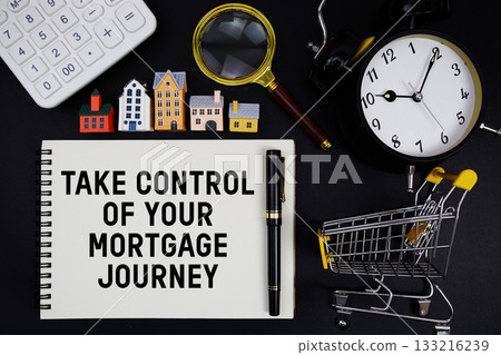 Notepad with the phrase "Take Control of Your Mortgage Journey" surrounded by a pen, calculator, magnifying glass, clock, mini trolley shopping cart and house model 133216239
