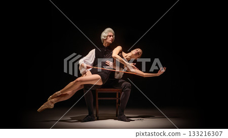 Baroque mentor guiding dancer as human instrument in dramatic stage composition Baroque mentor guiding dancer as human instrument in dramatic stage composition 133216307