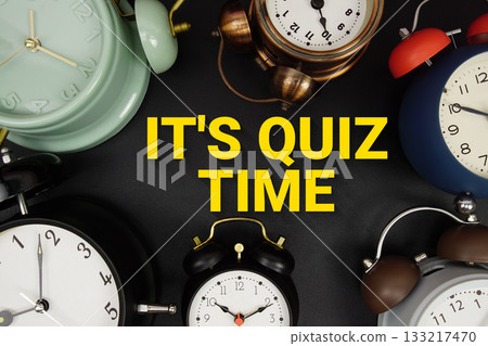 It's Quiz Time text with alarm clock on black background 133217470