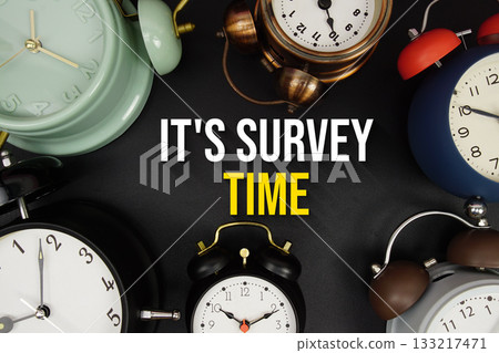 It's Survey Time text with alarm clock on black background It's Survey Time text with alarm clock on black background 133217471