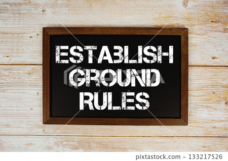 Establish Ground Rules text written on blackboard flat lay on wooden background Establish Ground Rules text written on blackboard flat lay on wooden background 133217526