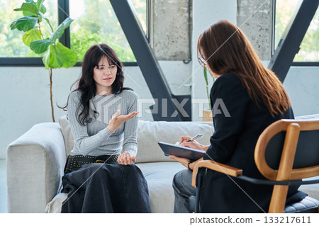 Psychology session for young female patient, professional help and support 133217611