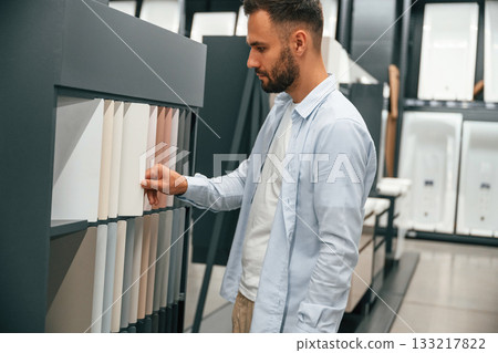 Man is in the hardware shop Man is in the hardware shop 133217822