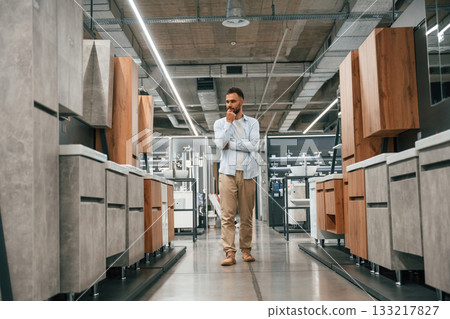 Furniture and cabinets. Man is in the hardware shop Furniture and cabinets. Man is in the hardware shop 133217827