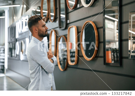 Products for the home. Man is in the hardware shop Products for the home. Man is in the hardware shop 133217842