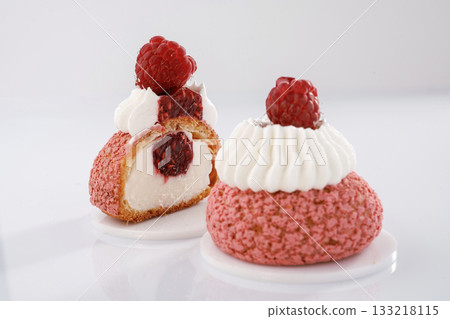 With raspberry on top. Seasonal delicious tart against white background With raspberry on top. Seasonal delicious tart against white background 133218115