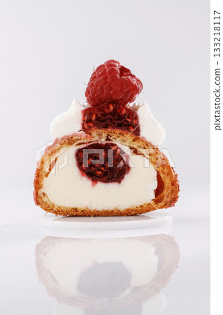 With raspberry on top. Seasonal delicious tart against white background With raspberry on top. Seasonal delicious tart against white background 133218117