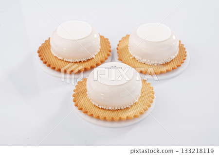 Lot of sugar. Sweet cakes on the white surface Lot of sugar. Sweet cakes on the white surface 133218119