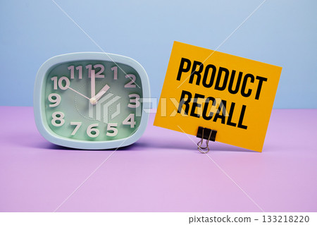 Product Recall text and alarm clock on blue and purple background Product Recall text and alarm clock on blue and purple background 133218220