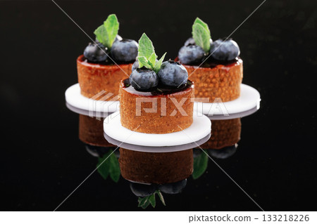 Art of cooking. Desserts, sweets on the black background Art of cooking. Desserts, sweets on the black background 133218226