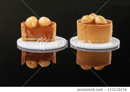 On the black background. Desserts, sweets 133218256