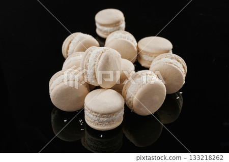 White colored. Macarons on the black surface White colored. Macarons on the black surface 133218262