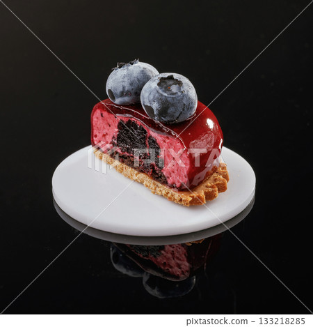 With blueberry. Delicious cake against black background 133218285