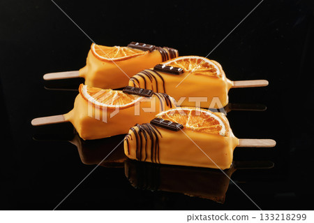 Like ice cream. Tasty cheesecakes on the black background Like ice cream. Tasty cheesecakes on the black background 133218299