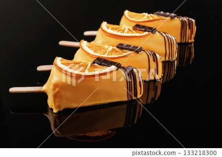 Like ice cream. Tasty cheesecakes on the black background Like ice cream. Tasty cheesecakes on the black background 133218300