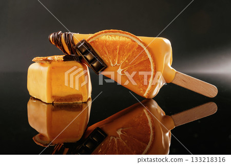 Side view. Tasty cheesecakes on the black background Side view. Tasty cheesecakes on the black background 133218316