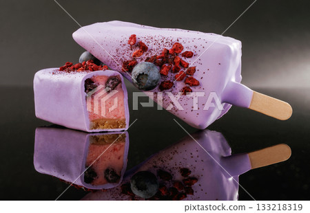Side view. Tasty cheesecakes on the black background Side view. Tasty cheesecakes on the black background 133218319