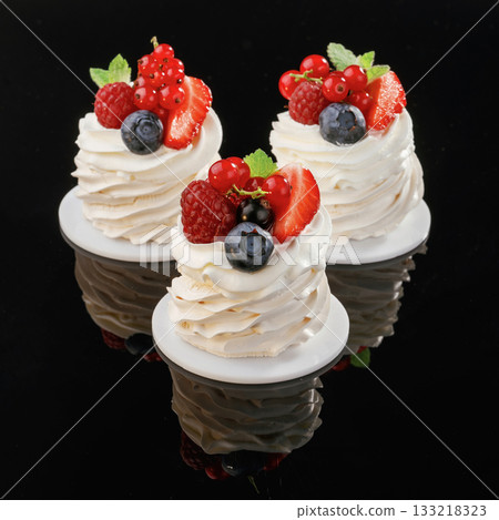 With blueberry. Delicious cake against black background With blueberry. Delicious cake against black background 133218323