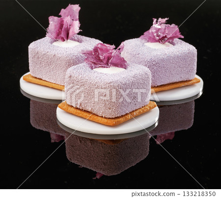 Ready to eat. Delicious cake against black background Ready to eat. Delicious cake against black background 133218350