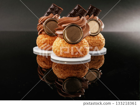 Quality product. Delicious cake against black background 133218361