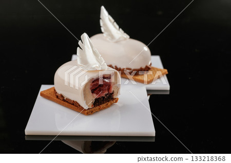 Special offer. Delicious cake against black background 133218368